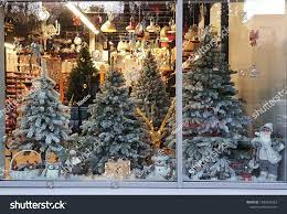 Snowy Artificial Christmas Trees In Shop Window Display With Various Holiday Decorations And Santa To Christmas Tree Shop Christmas Stock Photos Christmas Tree