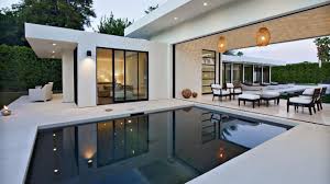 Modern Pool Flanks Covered Patio Modern Pools Indoor Outdoor Living Swimming Pool Designs