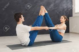 Yoga poses for balance and flexibility. Young Couple Practicing Yoga Together Man And Woman Sitting On Mat And Doing Navasana Pose Copy Space Partner Yoga Balance Flexibility Concept Stock Photo Picture And Royalty Free Image Image 96292070