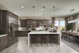 Sleek Modern Kitchen Design With Glass Pendant Lights Dark Wood Accents Modern Kitchen Design Kitchen Design Kitchen Furniture Design
