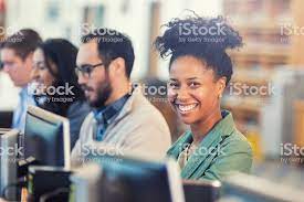 Pretty African American Woman With Natural Curly Hair Smiling At Education College Job Training African American Women