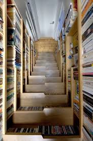 Ingenious Solution To A Book Storage Problem And Created A Loft Like Bedroom Nestled Under The Roof Of The T Book Staircase Staircase Bookshelf Bookcase Stairs