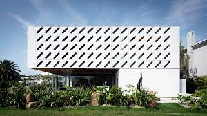 casa ventura arquitetura nacional white shutters facade ventura