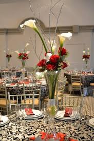 White Callas And Red Roses With Silver Accented Greens For A Fabulous Wedd Red Rose Centerpiece Wedding Tall Wedding Centerpieces Calla Lillies Centerpieces