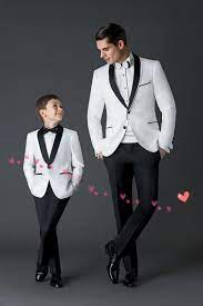 Wearing a charcoal suit with a white shirt and black tie and shoes is more appropriate as you draw. New Wedding Suits For Men White Grooms Tuxedos Shawl Lapel Boys Mens Suits Two Piece Groomsmen Suit Slim Fit Two Button Jacket Pants Tie001 From Haohua888 68 Wedding Suits Groom Tuxedo For Men