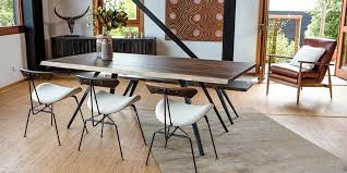 the vega dining table has a free edge black cast iron legs and a seared oak table top design furnituredesign interiordesign dining table furniture dining