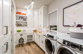 Lighten up your master closet with a cool chandelier or lamp. The Connected Laundry Housing Design Matters