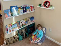 We chose simply white paint for the bookcase to tie in to the wall color of the room. Ikea Hack How To Turn Ikea Picture Ledges Into Floating Bookshelf