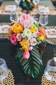 These crafted or floral table you don't need tropical leaves to steal this pretty centerpiece idea. Wedding Picture Tropical Wedding Flowers Centerpieces