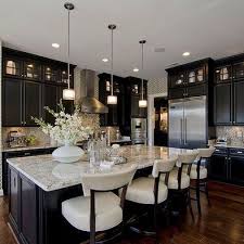 Dark Tall Cabinets With Dark Floors And Light Marble Countertops Simple Crisp And Elegant Gorgeous Kitchens Kitchen Remodel Home