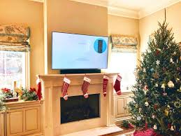Frank wall mounting samsung frame art tv over fireplace with all wires hidden. Tv Over Fireplace Tv Mounting Service Tv Wall Mount Installation Tv Bracket Installation Tv Mount Mount Tv