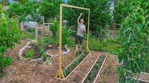 Then, just line the two short pieces of 2×4 up with the bottom cross piece. How To Build A Tomato Trellis Using Only One Piece Of Wood Cheap And Easy Backyard Gardening Youtube