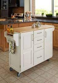 Pin By Kristy Davidson On Banheiros E Cozinhas White Kitchen Cart Kitchen Design Small Small Kitchen Storage