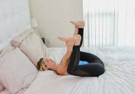 10 Sleep Promoting Yoga Poses You Can Do Right In Bed Yoga Poses Night Time Yoga Yoga Poses For Sleep
