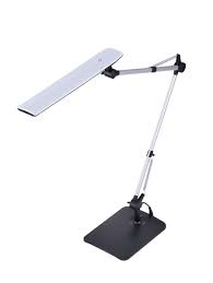 It has a led light. Dual Swing Arm Desk Lamp Black Bostitch Office