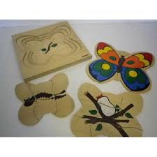 All 5 layers are mostly visible. Borrow 4 Layer Wooden Growth Puzzle Butterfly