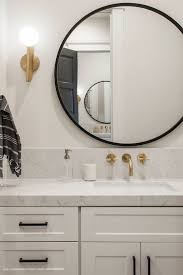 Vintage items are repurposed, like old hand try these 40+ farmhouse mirror ideas to bring an extra sense of charm and grace to your home. Farmhouse Bathroom With Black Metal And Gold Finishes New Modern Farmhouse Trends Farmhouse Bathroom Vanity Modern Farmhouse Bathroom Bathroom Vanity Makeover