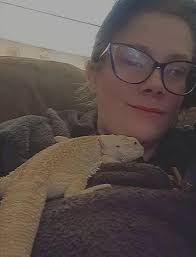 They said get a bearded dragon, it'll be fun. There's a food and water bowl  under there somewhere..