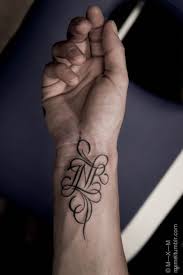 Initial tattoos are a good way to show love towards a person without having to tattoo the entire the good thing about initial tattoos is that they are ideal for both men and women and always have a. Simple Lettering Tattoo Design Novocom Top
