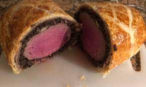 Beef Wellington, pre cooked at 57c for 2.5 hours then finished later in the  oven in its mushroom and pastry duvet. Would be too scared to tackle this  without SV. Surprised myself
