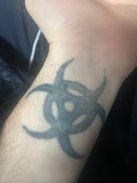 Got this shit tattoo when I was 15 by a classmate. Apparently in the gay  community a Biohazard tattoo means you have HIV. So that's great… glad it's  on my wrist for