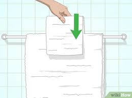 How to make towels look like a hotel with fancy folding. 3 Ways To Arrange Towels On A Towel Bar Wikihow