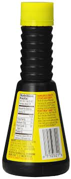 The back of a black bottle of Kitchen Bouquet browning sauce, showing its yellow label with nutrition information and a barcode.