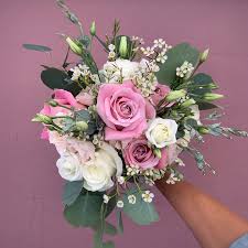 Maybe you would like to learn more about one of these? Jim Ludwig S Blumengarten Florist This Bridesmaid Bouquet Complimented The Bride S All White And Whisper Of Pink Bouquet With Dusty Pink Roses Blush Spray Roses Delicate Wax Flower White Roses Whimsical Lisianthus