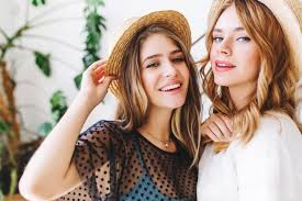 This tag is for the more natural effect of curly hair. Free Photo Close Up Portrait Of Wonderful Girls With Curly Hair Posing In Hats In Front Of Wall With Plant