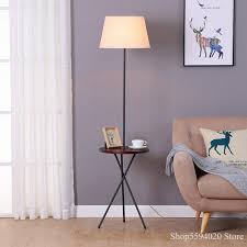 Maybe you would like to learn more about one of these? Nordic Wooden Desk Floor Lamp Modern Simple Tripod Floor Lamp Shelf Floor Lamp Living Room American Tea Table Floor Lamp Floor Lamps Aliexpress