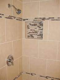 Shower Tile Installation Using 12x12 Porcelain With A Linear Glass Tile Accent Band In Wesley Chapel Florida Linear Glass Tile Glass Tile Accent Shower Tile