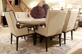 This set pegs transitional style in your space with brass nailhead trim, sloped arms and patterned upholstery. Tan Cloth Dining Chairs Wooden Table Metal Base Upholstery Fabric For Chairs Brown Accent Chair Oversized Chair And Ottoman