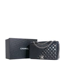 CHANEL - Pre-owned Coco Boy shoulder bag in black quilted leather | ORMAIN