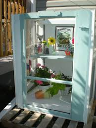 Obsessed with this diy greenhouse made from old windows! 15 Creative Diy Mini Indoor Greenhouses
