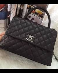 Get the best deals on chanel makeup bags and cases. The Coco Handle Bag Comes With A Front Flap A Handle On Top And Intertwined Chain Leather Shoulder Strap It Features A Trapezoid Desig Chanel Bag Bags Chanel