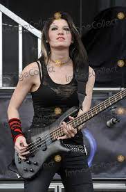 Photo of shimon moore and emma anzai and mark goodwin and sick puppies; Photos And Pictures 21 May 2011 Columbus Ohio Bassist Emma Anzai Of The Australian Rock Band Sick Puppies Performs As Part Of The Rock On The Range Festival Held