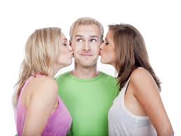 Man Being Kissed by Two Girls Stock Photo - Image of attractive, three:  21531366