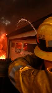 Winds churn California wildfires, keep aircraft from helping