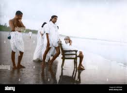 Mahatma Gandhi sitting on chair and ...