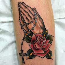 The truth behind this tattoo is that it actually stands for the meaning of peace. Hands Pray Roses Rosary Tattoo Hand Tattoos For Women Praying Hands Tattoo Roseary Tattoo