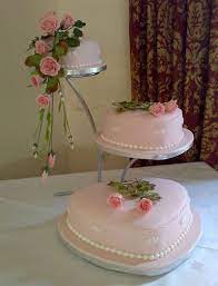 The beauty of a white wedding cake is the many ways in which it can be dressed up with traditional or modern elements. Heart Shaped Wedding Cake Designs 2019 Addicfashion