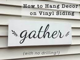 How To Hang Decor On Vinyl Siding With No Drilling Diy Vinyl Siding Patio Signs Outdoor Siding