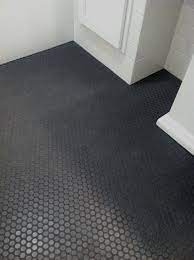 Square white tiles and black hexagon tiles contrast in the shape and color. Best Reader Submitted Bath Space Winner Steve Carbin Remodelista Shower Floor Tile Penny Tiles Bathroom Penny Tile Floors