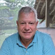 How to safely remove a honey bee hive from a garage wall in Oneonta, NY?