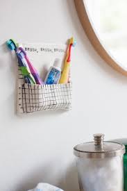 Diy pvc pipe toothbrush holders (via www.craftingintherain.com). Diy Air Dry Clay Toothbrush Wall Pocket Live Free Creative Co