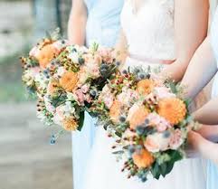 We will work within your budget and strive to assist you in all your wedding needs. Love These Amazing Bridesmaid Bouquets Featuring Orange Dahlias And Blue Thistle Bridesmaid Bouquet Wedding Bouquets Wedding