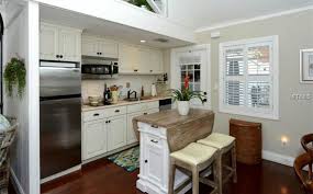 The butcher block top on this kitchen island flips up to become a table for. 25 Portable Kitchen Islands Rolling Movable Designs Designing Idea