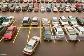 Top View Looking Down On Parking Lot Full With Cars And Shopper Car Parking Used Car Lots Cars Near Me