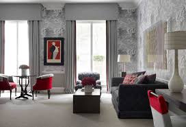 You can create specific accent walls and complement them with faux textures and solid patterns. Modern Grey And Red Living Room Idea