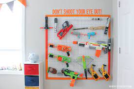Make your own diy nerf gun camo peg board with led lights behind it! Diy Nerf Gun Storage Inspiration Made Simple